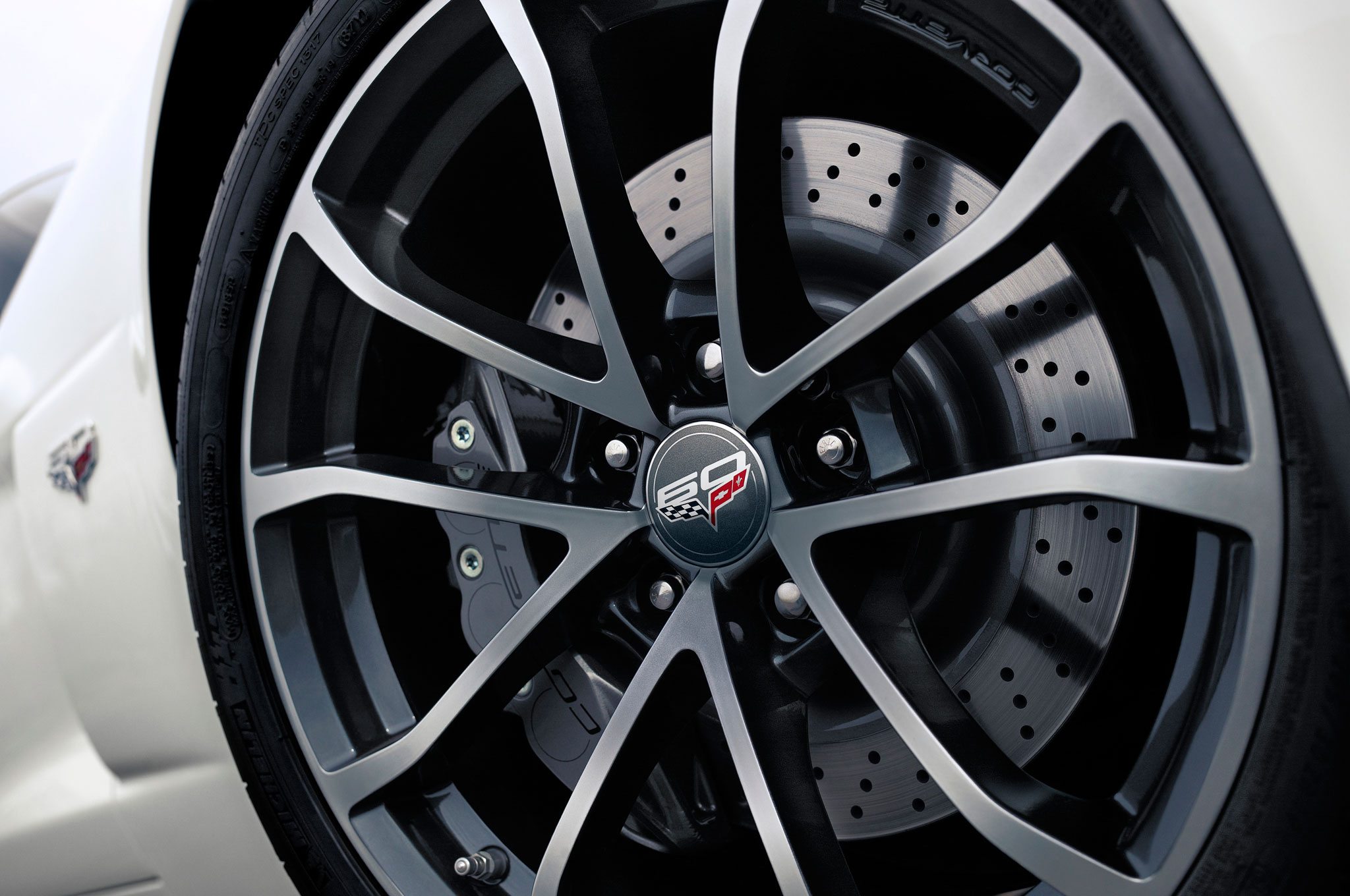 The 2013 427 Convertible Collectors Edition wheels featured a unique 10-spoke pattern and special "60" badging on the center caps.