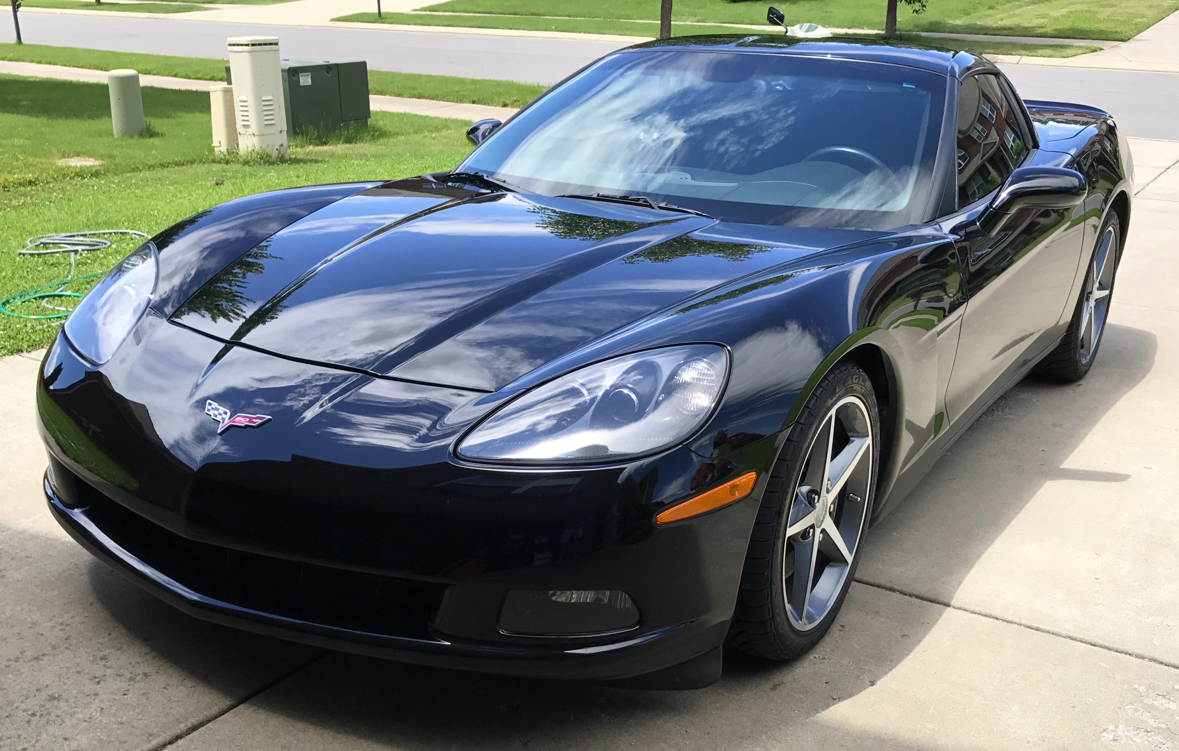 Scott Kolecki, content writer and Corvette enthusiast, preps his car for "Drive Your Corvette To Work" Day on Friday, June 30, 2017.