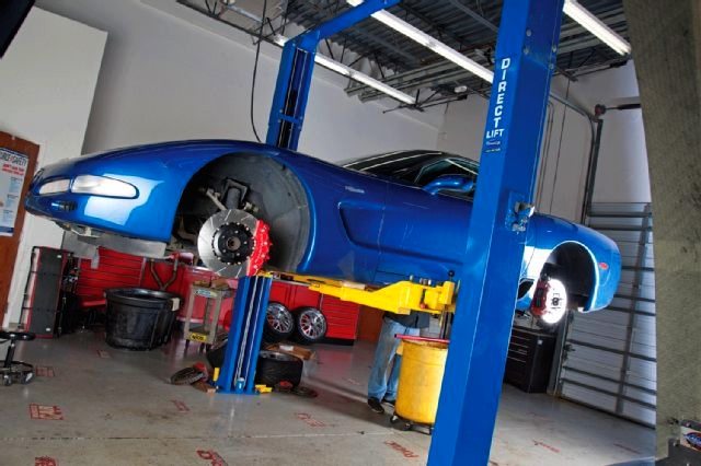 Blue Z06 Corvette on a lift