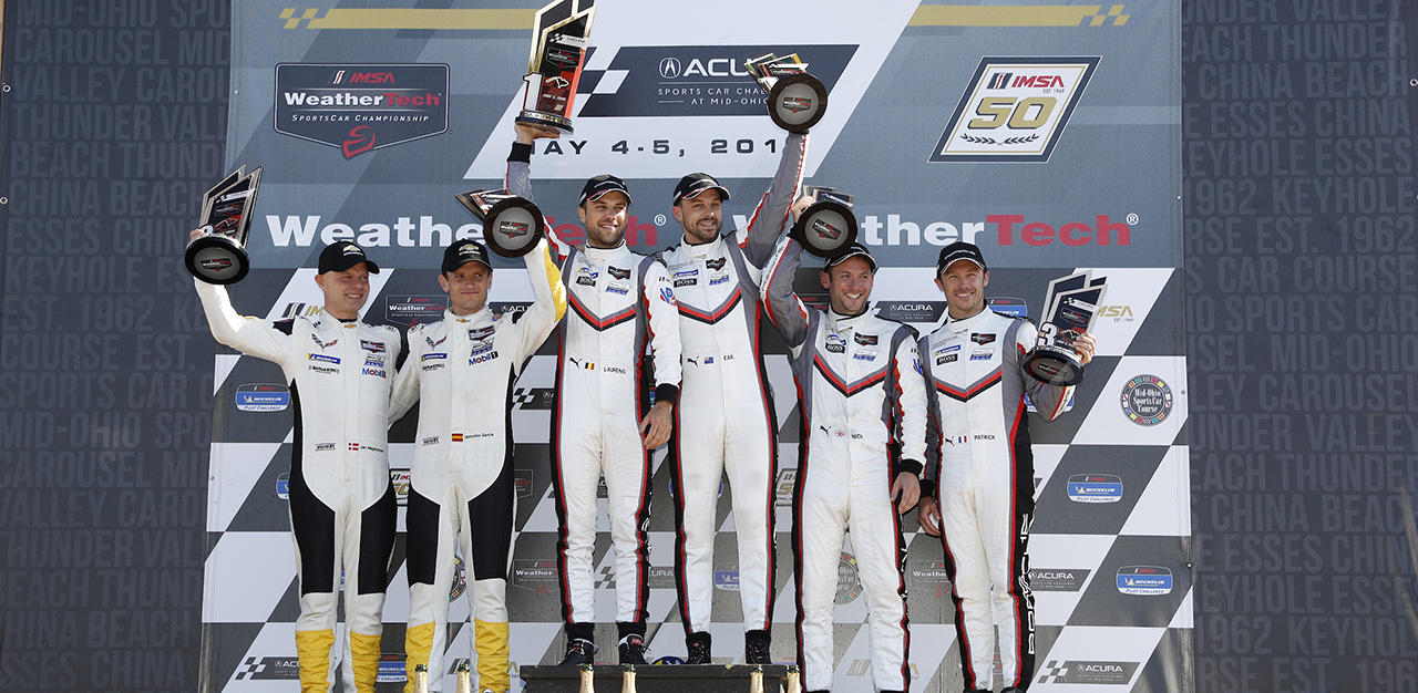 Jan Magnussen and Antonio Garcia on the podium at Mid-Ohio