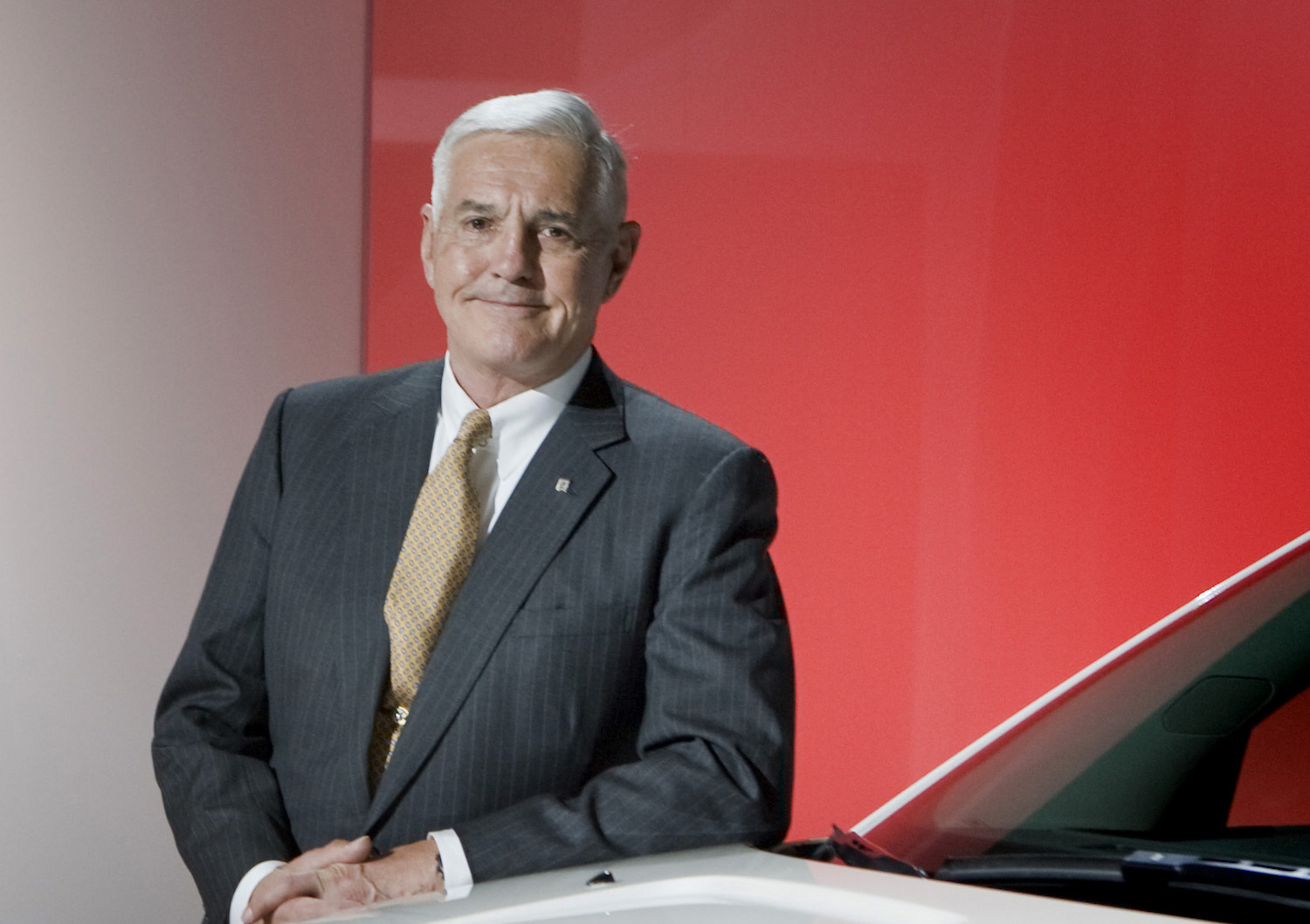 Bob Lutz with the 2011 GMC Acadia Denali luxury CUV