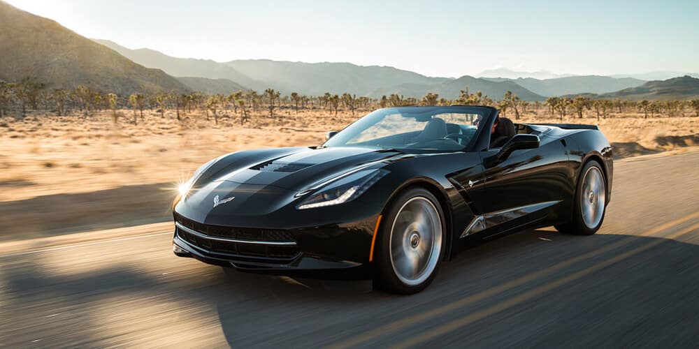 The 2018 Corvette Convertible finished in Black. Note the larger front and rear wheels.