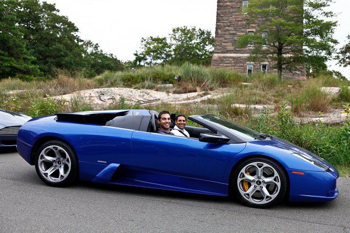 Nick riding shotgun in a Lamborghini Murcielago.