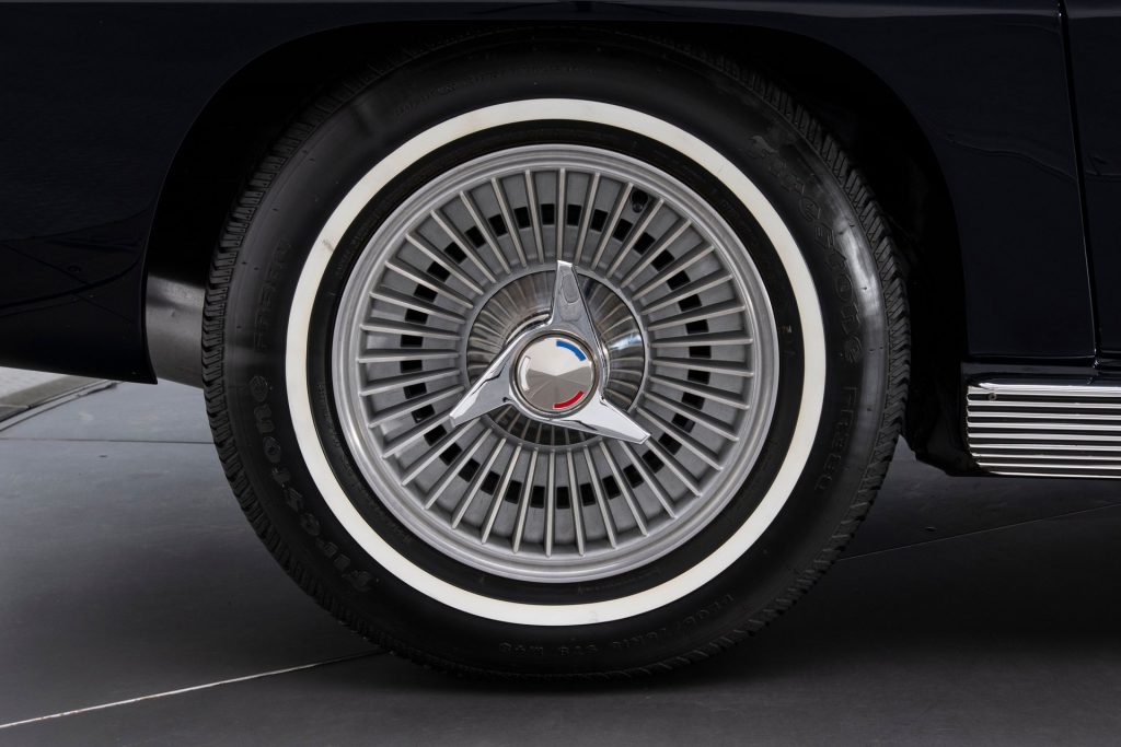 The 15-inch wheels on this car are wrapped in Firestone rubber and appear to be in like-new condition.