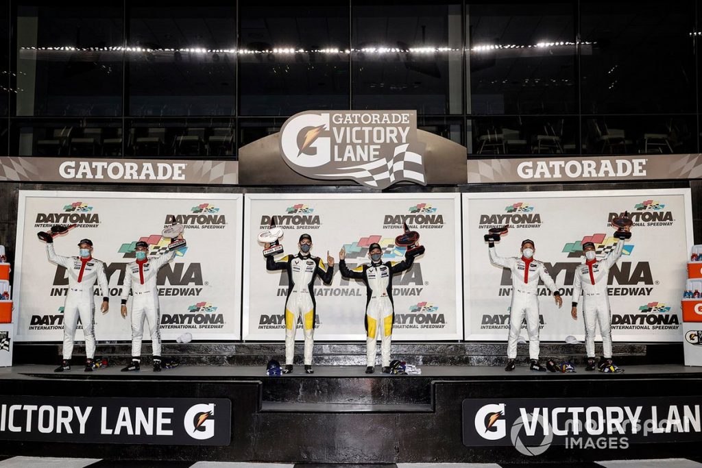 Jordan Taylor and Antonio Garcia (center) take first place in the GTLM class of the Daytona 240 on July 4, 2020.