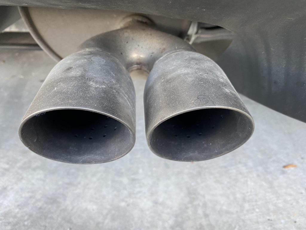 The exhaust tips on my 2013 Corvette coupe are due to normal driving (an average of 6,000 miles per year on this car).