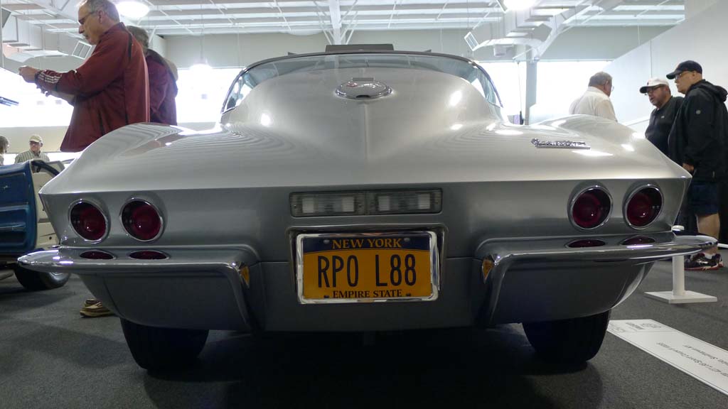 Silver C2 corvette with vanity plate