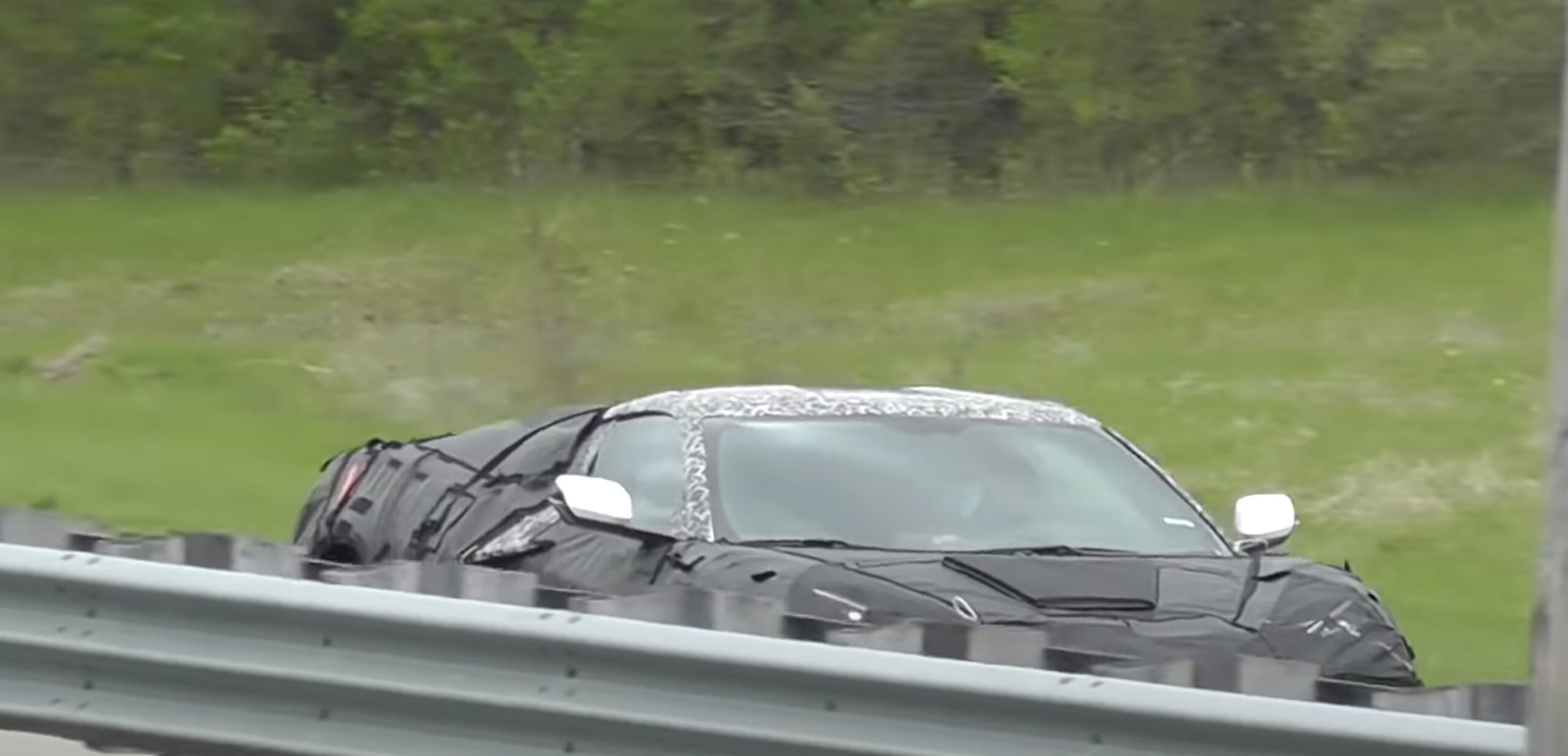 A side view of a new Corvette - possibly the 2023 C8 Z06