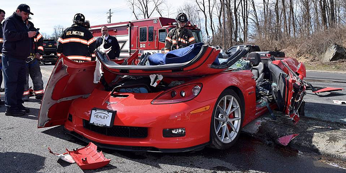 Red C6 Chevrolet Corvette wrecked