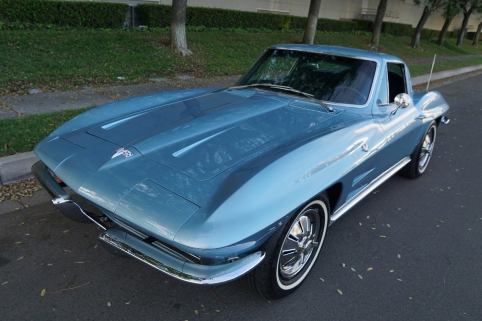 Light blue 1964 Corvette with L84 engine on city street