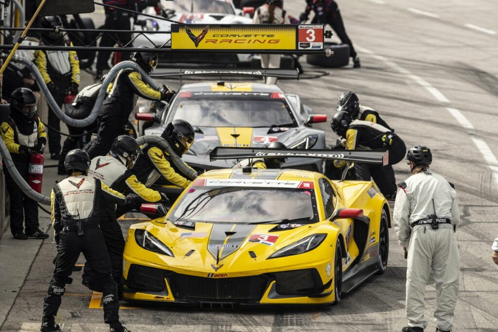 Both C8.R's of Corvette Racing pit during the race's single full-course caution.