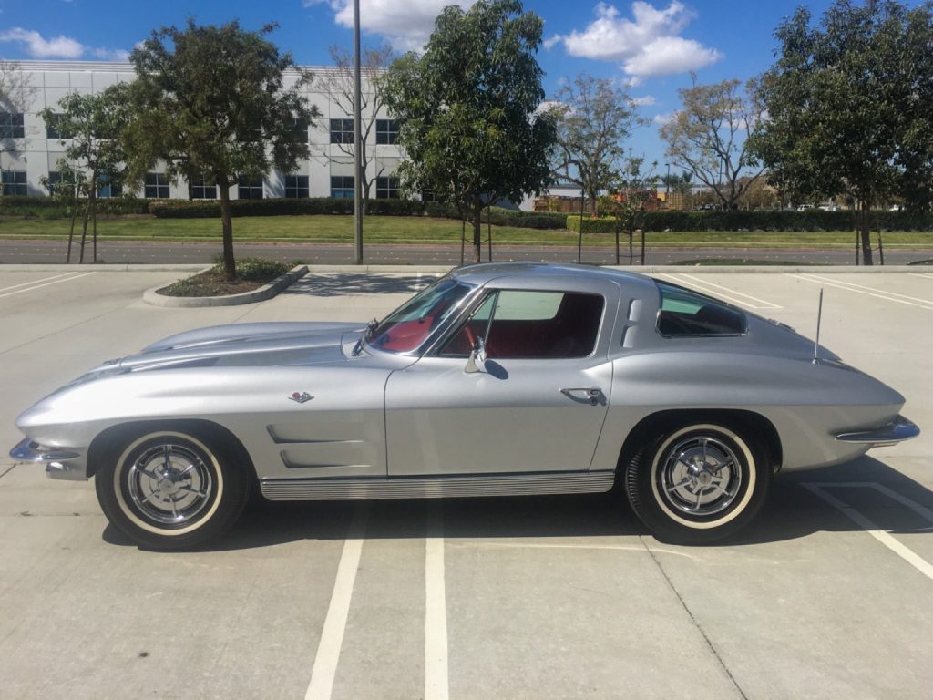 Silver 1963 Corvette Split Window with 327CI engine in parking lot