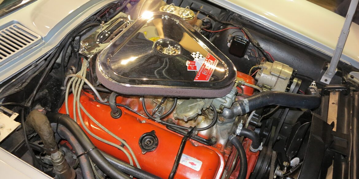 1967 L68 427CI engine in open hood of white C2 Corvette