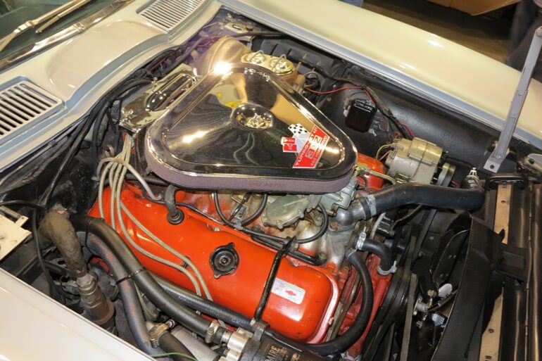 1967 L68 427CI engine in open hood of white C2 Corvette