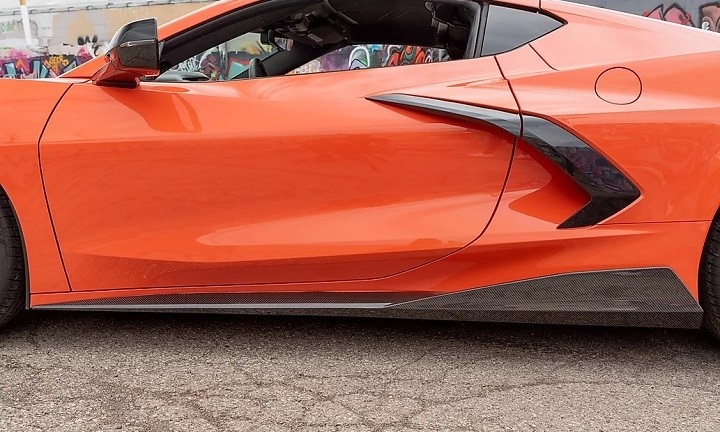 5VM Carbon Side Skirts by American Hydrocarbon on orange C8 Corvette