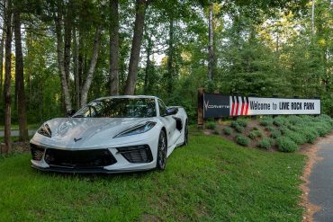 C8 Corvette parked next to Lime Rock Park Signage