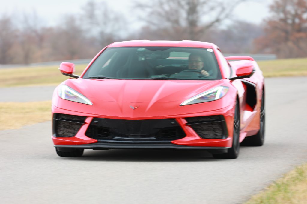 We didn't even know the photographer was there...those smiles are all about the miles (per hour) and the pure adrenaline of running wide open on a racetrack!