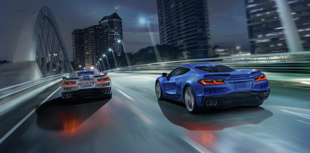Blue and silver 2024 Chevrolet Corvette E-Ray on the road