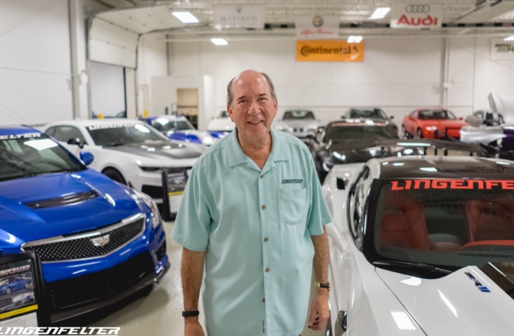 Ken Lingenfelter poses with some of the truly remarkable cars in his 250+ car collection.