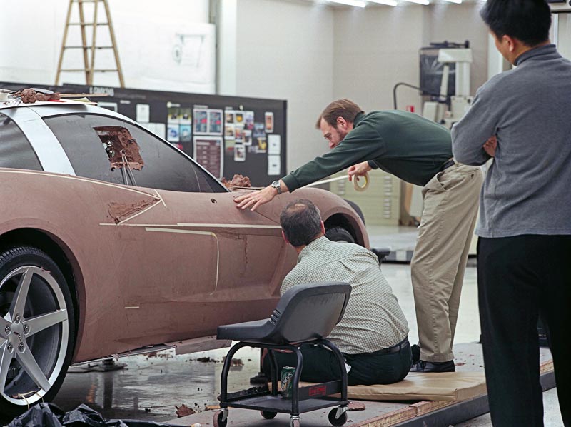 GM designers working on a full-scale clay model of the 2005 Corvette. (Image courtesy of GM Media.)