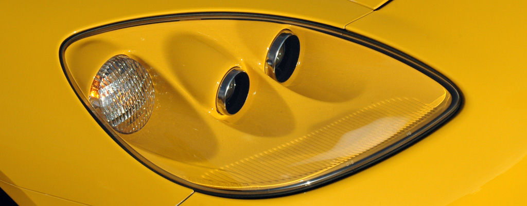 The exposed headlamp assembly of the C6 Corvette features a color-matched housing. (Image courtesy of the Corvette Story website.)