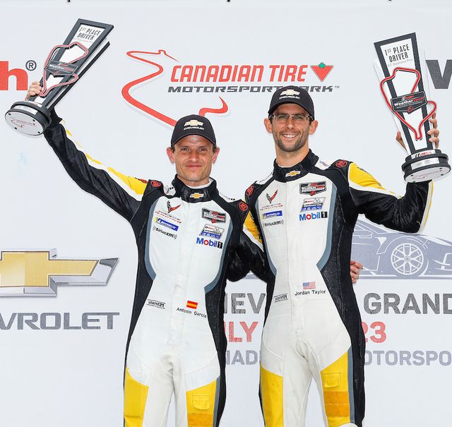 Antonio Garcia (left) and Jordan Taylor celebrate their win at Canadian Tire Motorsports Park as they clinch their first win this season!