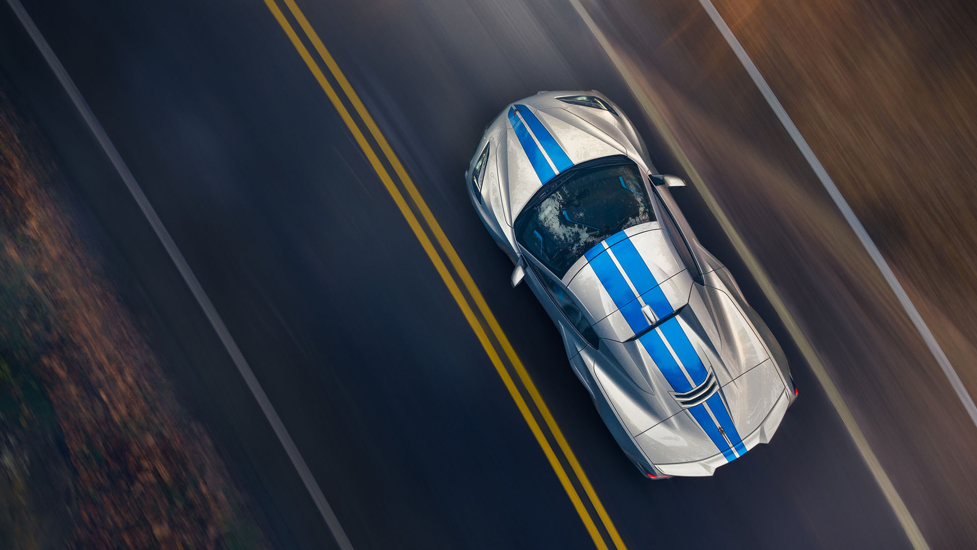 Aerial view of a Chevrolet Corvette E-Ray on a backroad