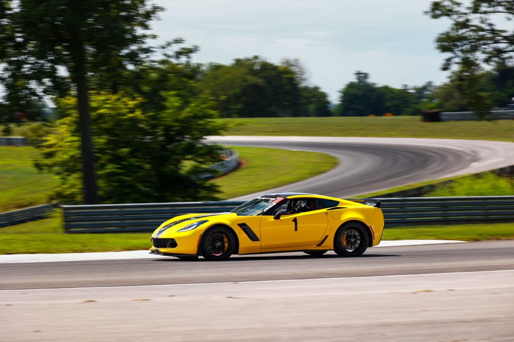 My instructor runs some fast laps during a "black" session on the track. Watching seasoned drivers on the track is a GREAT way to learn added skills, especially in the challenging corners. (Image courtesy of Cole Carroll / NCM Motorsports Park.)