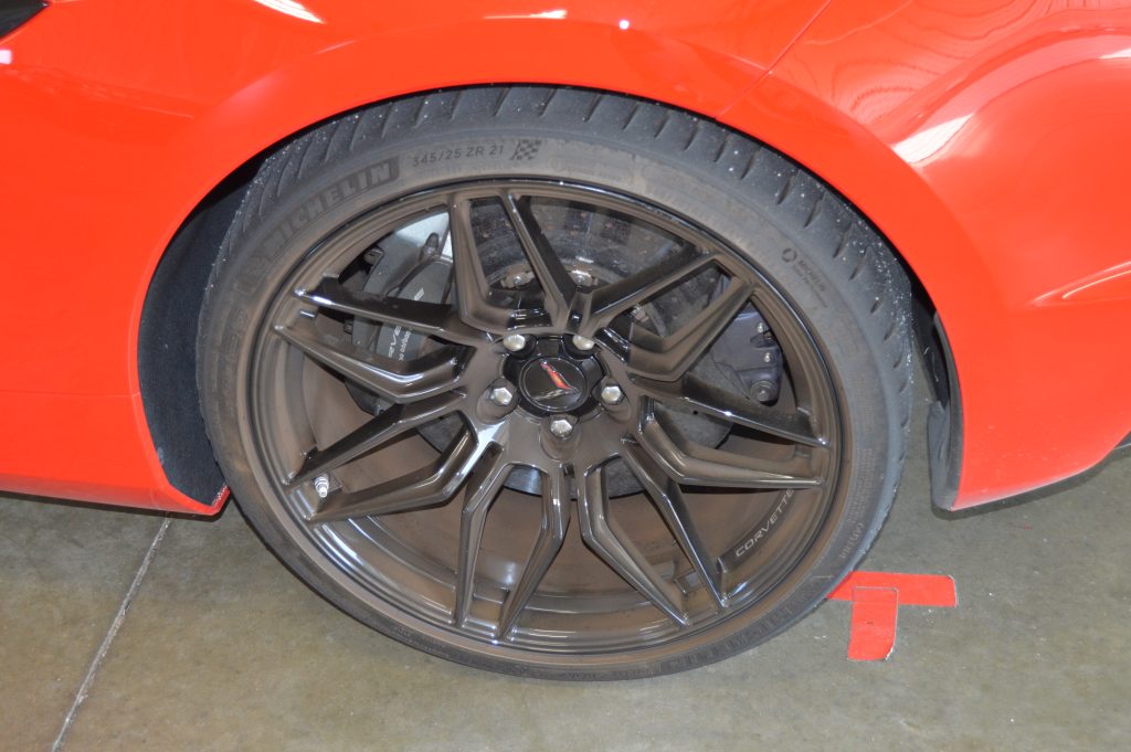 The 2023 Corvette Z06 rides on a set of Michelin 275/30R20 tires out front and 345/25R21 tires (like the one seen here) in the rear. 