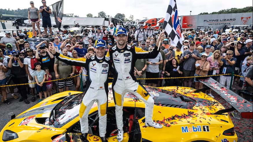 Drivers Antonio Garcia (left) and Jordan Taylor celebrate their win at VIR!