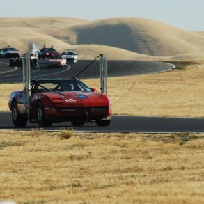 Red Chevrolet Corvette C4 powered by biodiesel on a racetrack