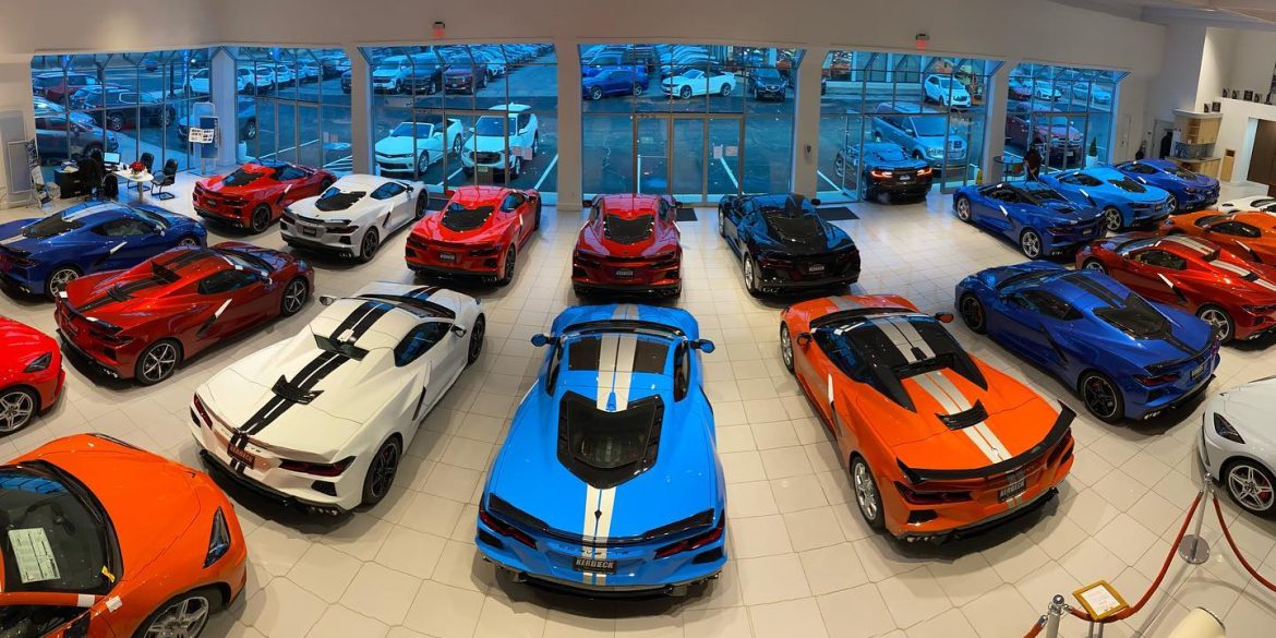Various Corvette models parked inside a showroom
