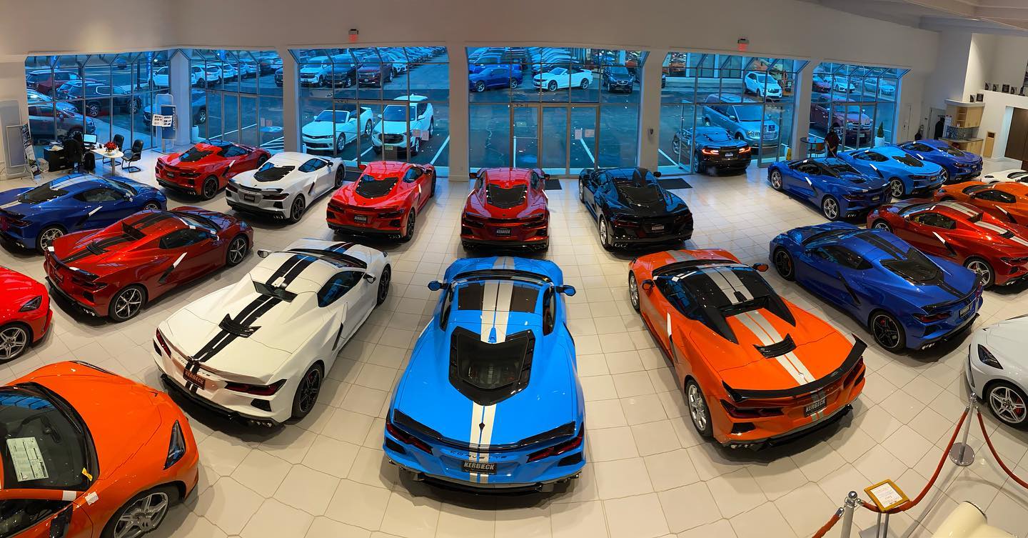 Various Corvette models parked inside a showroom