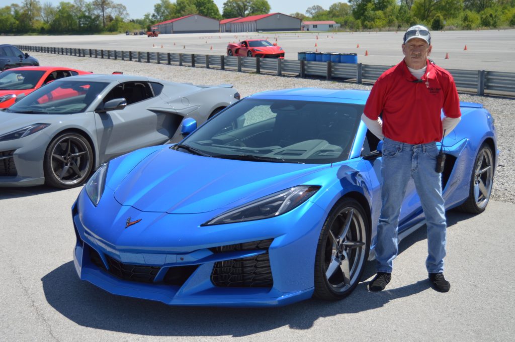 NCM Motorsports Park driving instructor Dale Saukas with the 2024 Corvette E-Ray. 