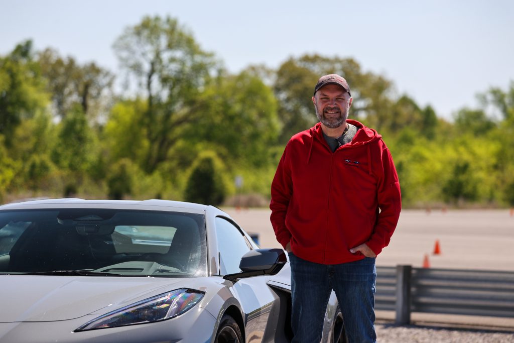 Getting ready to climb into the 2024 Corvette E-Ray. Yes, that stupid grin on my face is real - I'm like a kid at Christmas any time I get to visit the racetrack - especially in an E-Ray! (Image courtesy of NCM Motorsports Park)