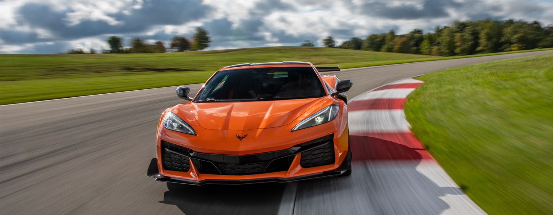Orange Corvette Z06 on the racetrack