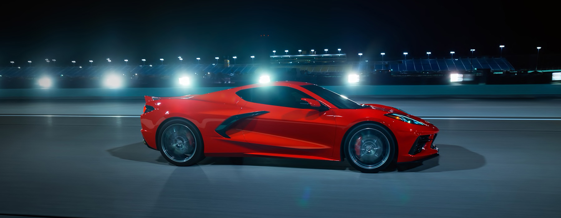Side view of a red C8 Corvette