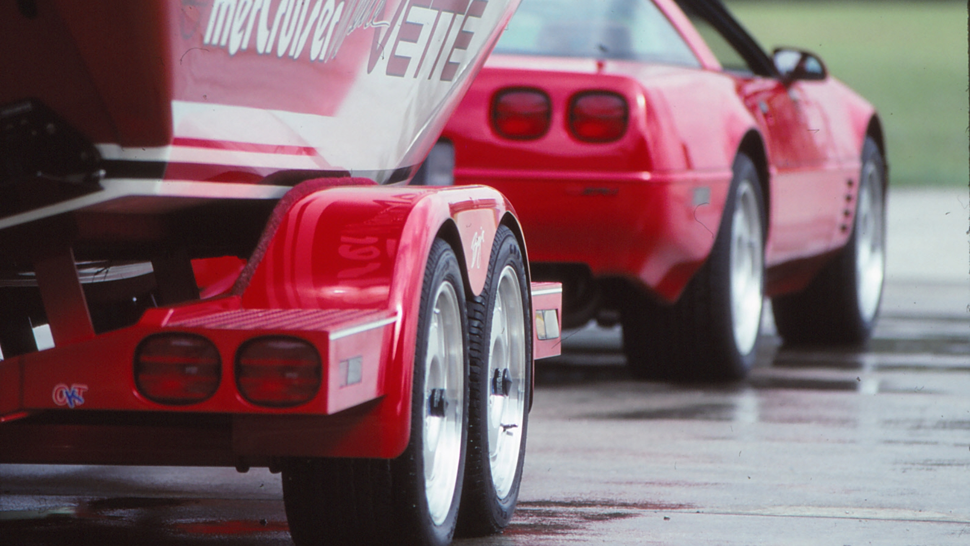 A red C4 Corvette ZR-1 towing the Wette Vette concept boat