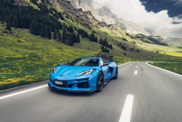 Front view of a 2025 Corvette E-Ray with mountain background