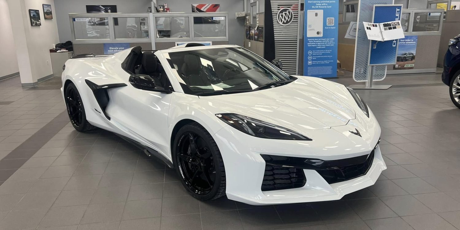 Three-quarter view of a 2024 white Corvette Z06 at a dealership