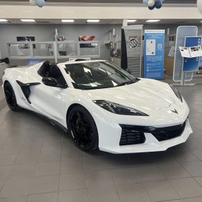 Three-quarter view of a 2024 white Corvette Z06 at a dealership