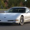Three-quarter front view of a white pearl C5 Corvette