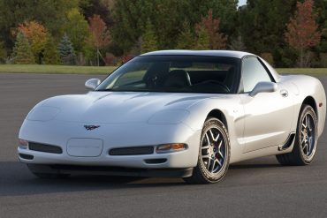 Three-quarter front view of a white pearl C5 Corvette