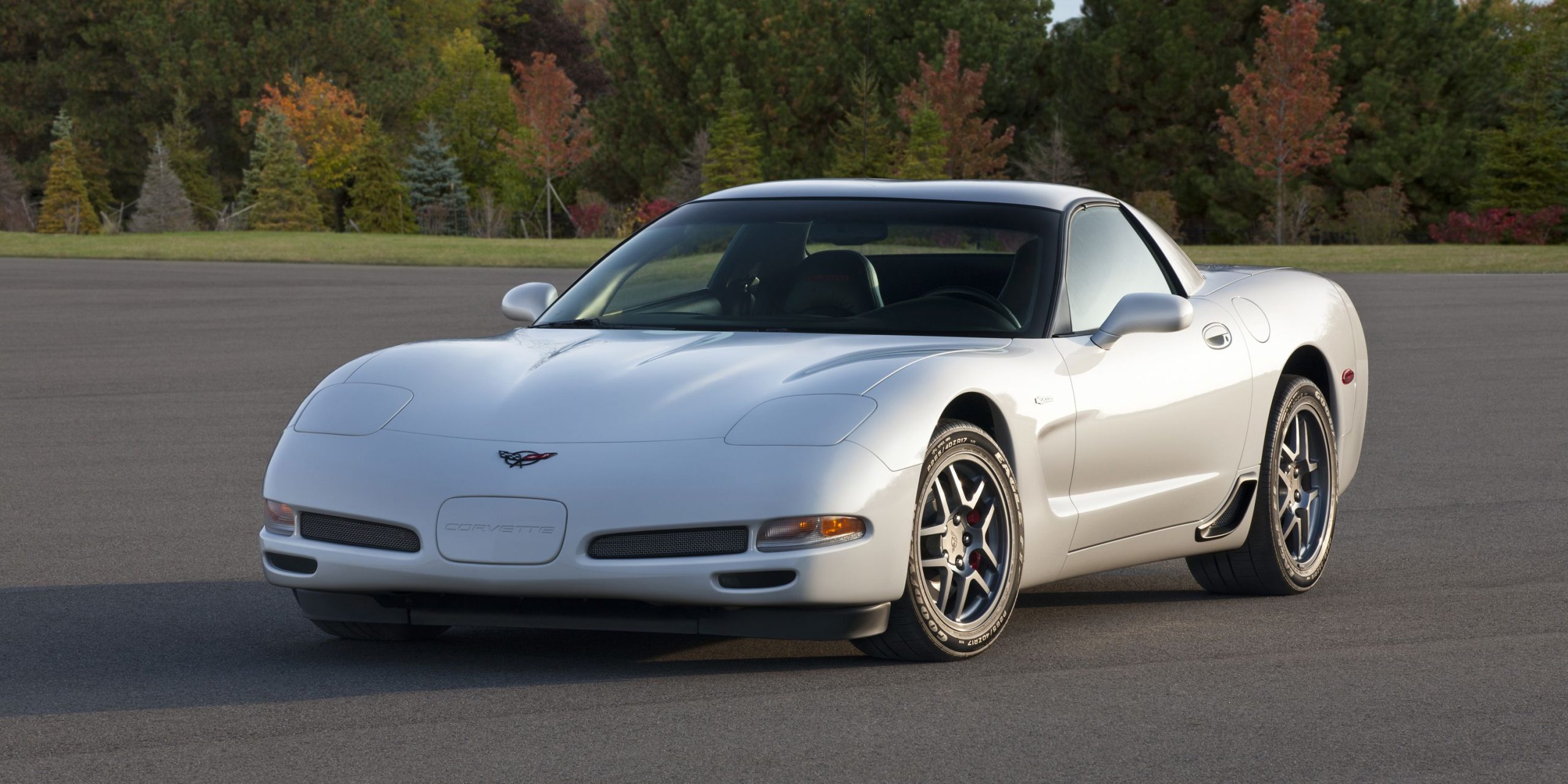 Three-quarter front view of a white pearl C5 Corvette