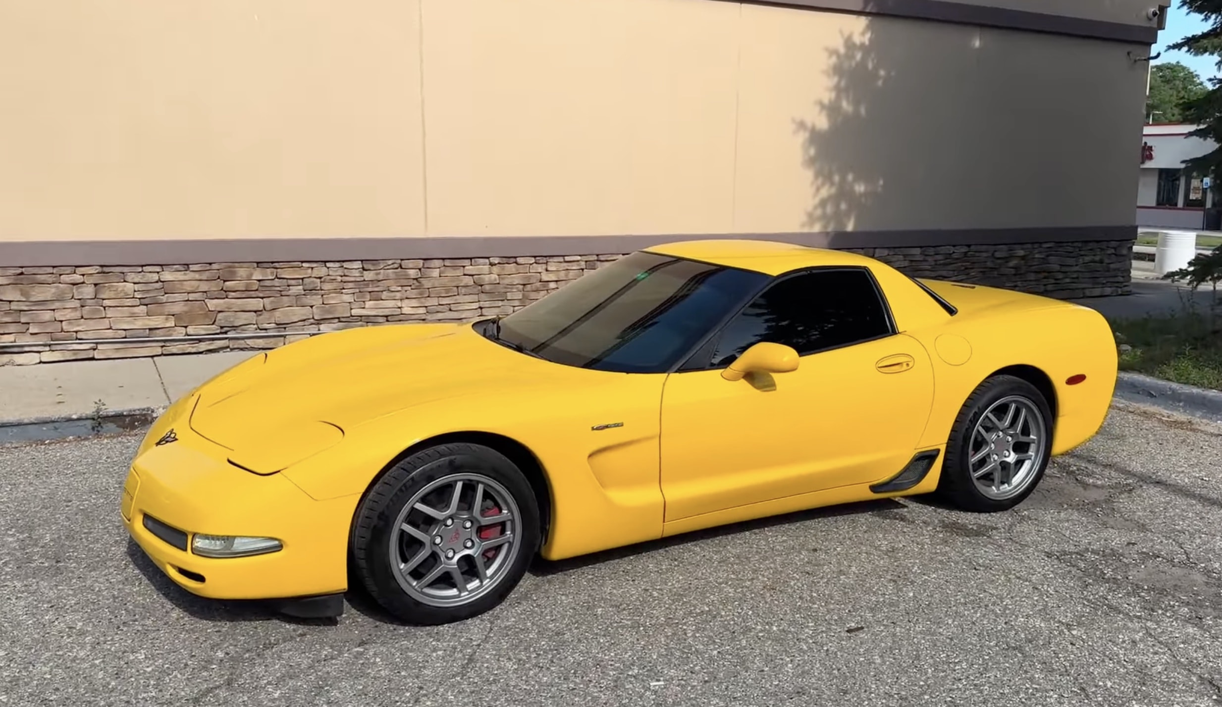 Three-quarter view of a yellow C5 Corvette