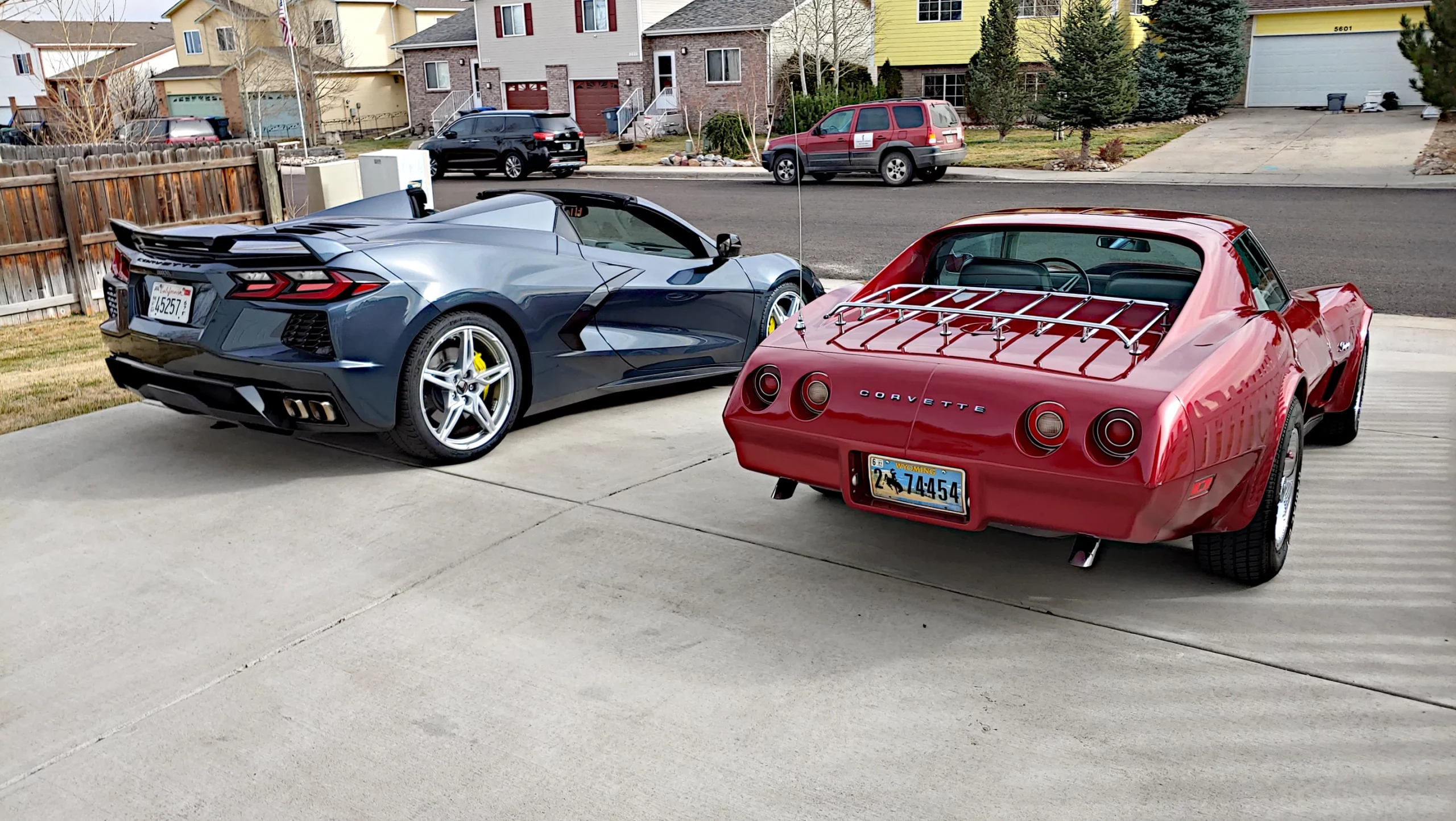 Gray C8 Corvette and red C3 Corvette side by side