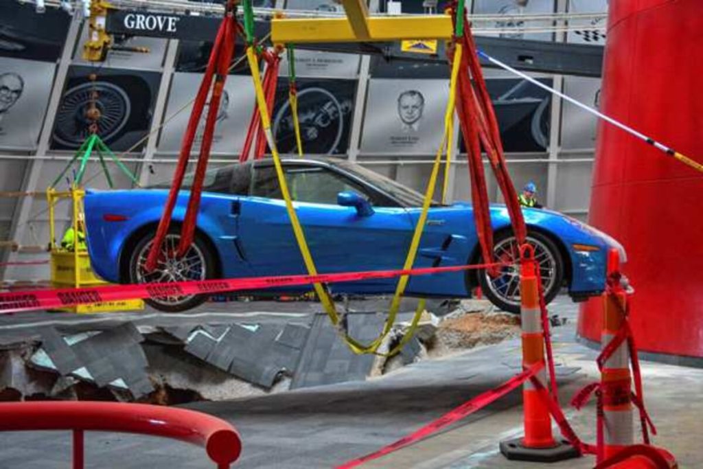 On March 3, 2014, the 2009 Corvette ZR1 “Blue Devil” became the first car lifted from the National Corvette Museum sinkhole. Suspended in bright rigging straps and carefully guided back onto solid ground, it emerged battered but unmistakably whole. Then came the moment no one expected: the supercharged LS9 fired to life, and the ZR1 moved under its own power across the Skydome floor before a fluid leak ended the brief drive. It was more than mechanical function—it was symbolism. Even after a 30-foot fall into limestone darkness, Corvette’s flagship refused to stay silent.