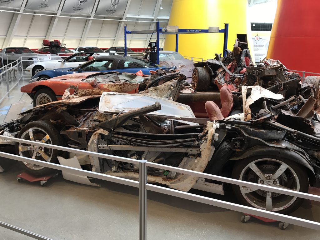 When the Skydome reopened in July 2015, the floor was repaired, reinforced, and once again structurally sound—but the museum made a deliberate decision not to erase what had happened there. Several of the sinkhole cars were returned to the very space where the collapse occurred, displayed inside the rebuilt Skydome as recovered. Twisted frames, crushed composite panels, exposed mechanicals—left visible, not hidden. The setting was pristine again; the cars were not. That contrast was intentional. Visitors now stand on engineered stability while looking directly at the physical consequences of that February morning. The Skydome was restored—but the story remained on full display.